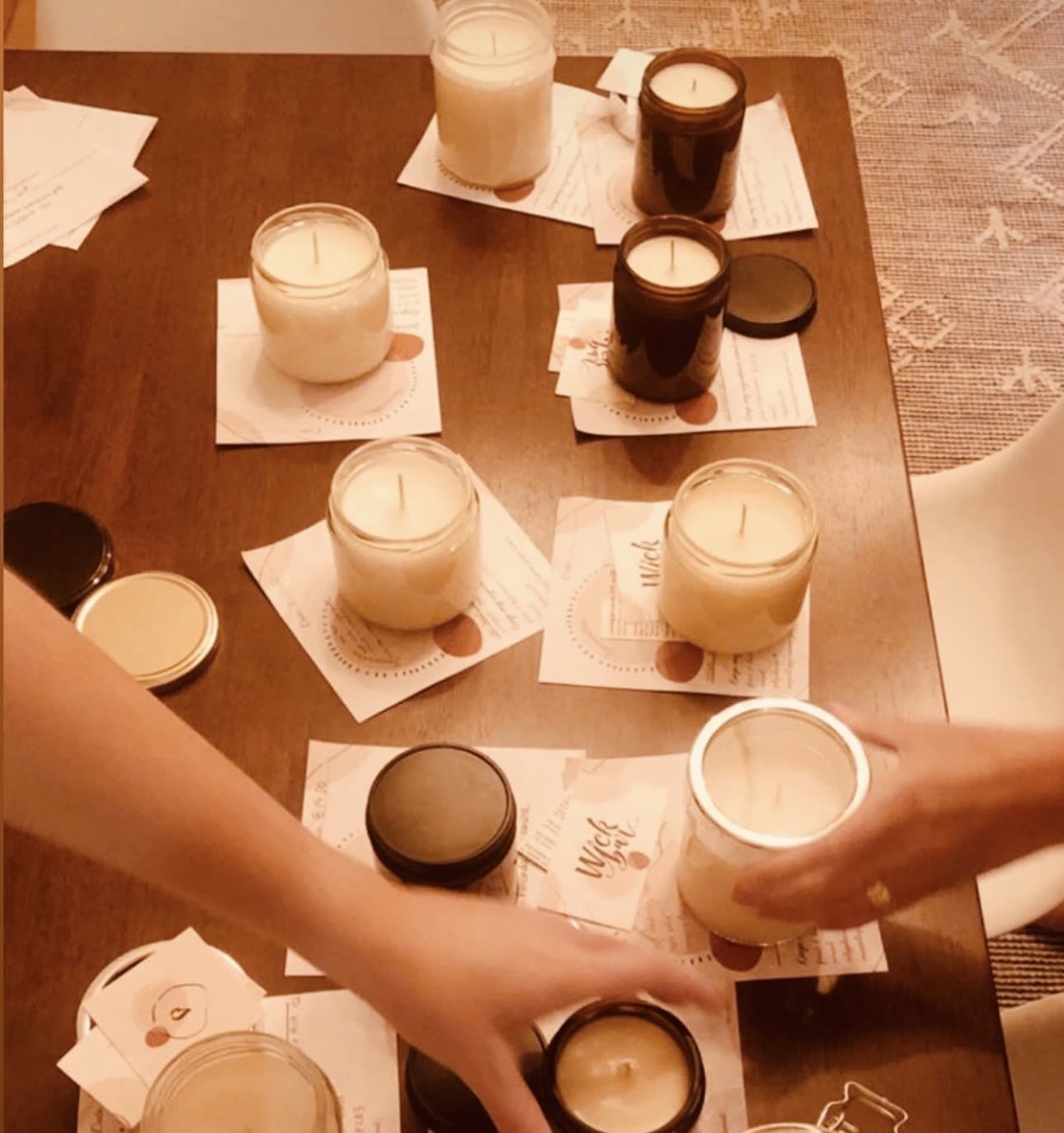 Freshly poured candles cooling on the table, seen from above.