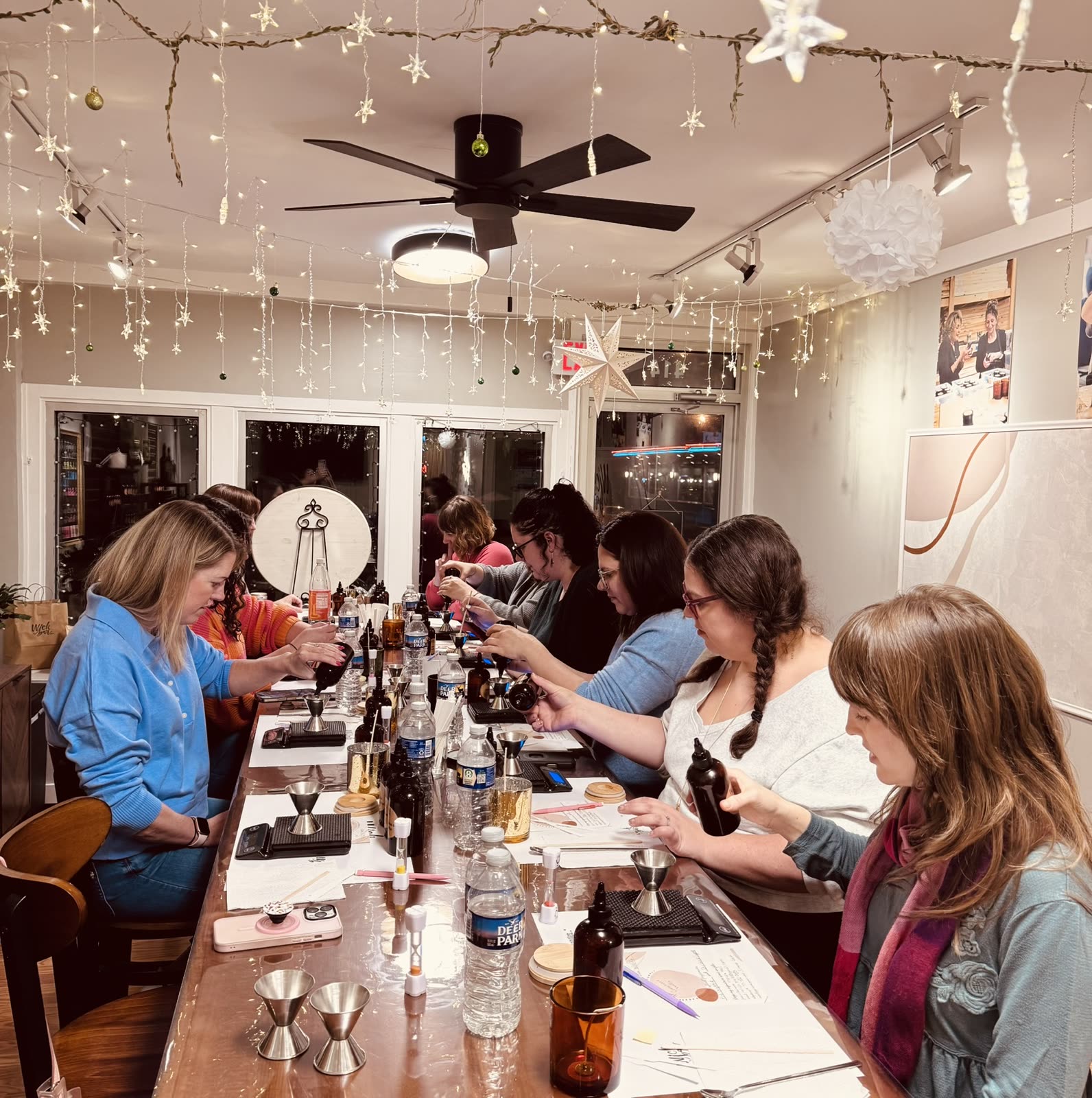 An evening class at Wick Bar under the studio's string lights.